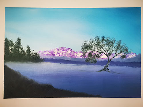 Lone tree on a Misty Lake.